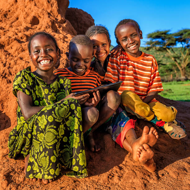 istock Little African children using digital tablet, East Africa 1048195042