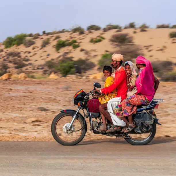 Indian family of 4 on a motorcycle, Rajasthan, India.