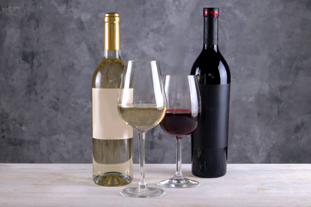 istock Showcase of vintage wine bottles with empty sticker labels. 1048203872