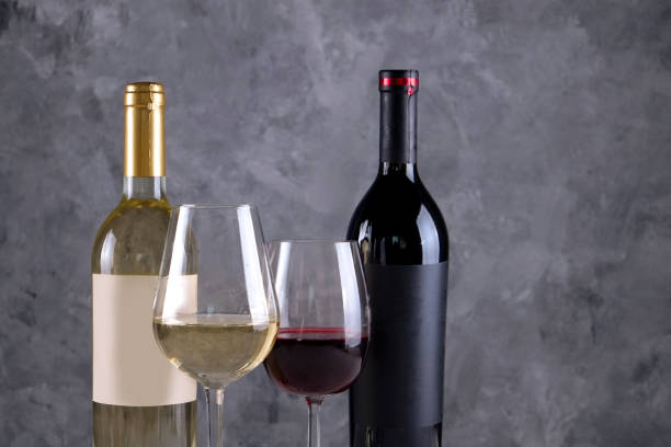 istock Showcase of vintage wine bottles with empty sticker labels. 1048203932