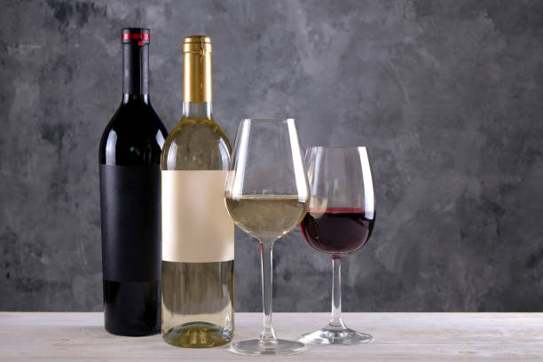 istock Showcase of vintage wine bottles with empty sticker labels. 1048203938