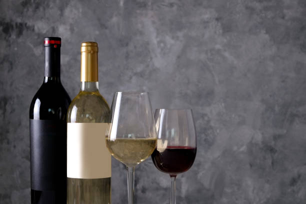 istock Showcase of vintage wine bottles with empty sticker labels. 1048203954