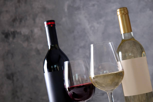 istock Showcase of vintage wine bottles with empty sticker labels. 1048204226