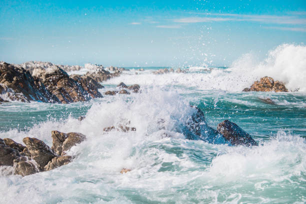 istock Dramatic crashing waves hitting rocks on the shore. 1048206932