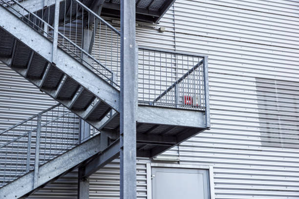 istock Abstract industrial architecture fragment on blue sky background, metal stairway sections 1048212402