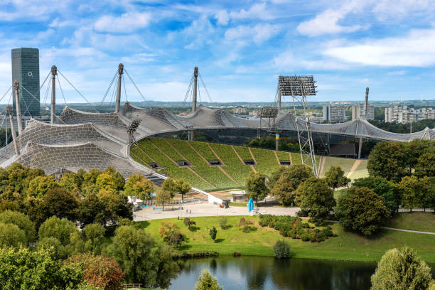 Munich, Germany - September 8th, 2018: Aerial view of the Munich Olympic Stadium (Munchner Olympiastadion 1972) in the Olympic Park (Olympiapark), Bavaria, Germany, Europe. The stadium was built as the main venue for the 1972 Summer Olympics. Designed by the German architect Günther Behnisch and the engineer Frei Otto, with the assistance of John Argyris, the lightweight tent construction of the Olympiastadion was considered revolutionary for its time.