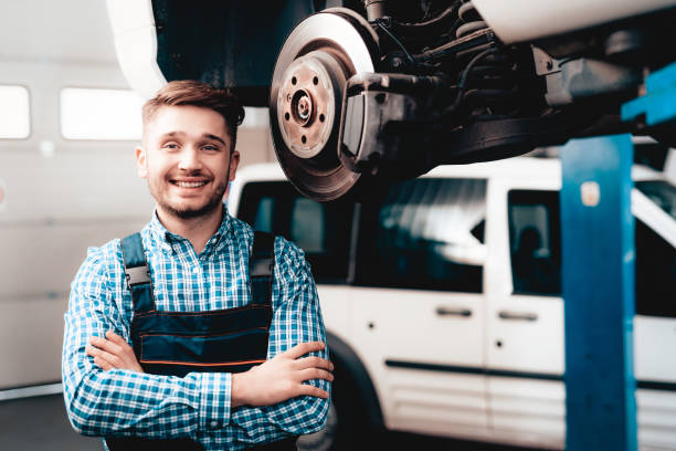 istock Young Mechanic Posing With Wrench In The Garage. 1048213842