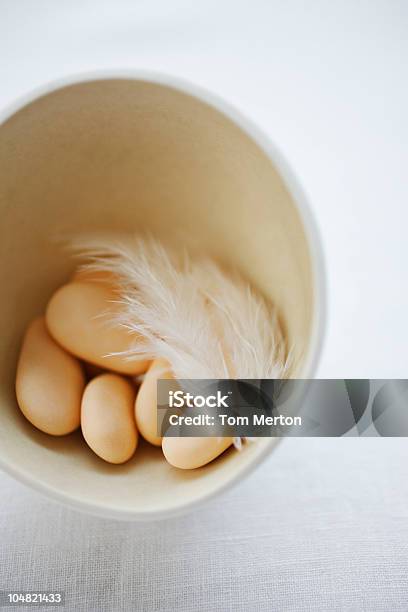 Candy Eggs In Bowl With Feather Stock Photo - Download Image Now - Candy, Close-up, Color Image