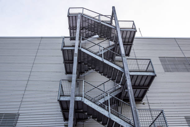 istock Abstract industrial architecture fragment on blue sky background, metal stairway sections 1048216024
