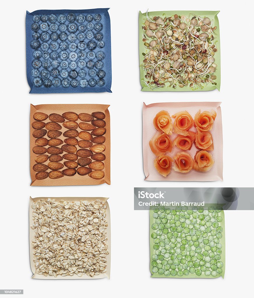 Berries, nuts, vegetables and herbs in dishes  Oats - Food Stock Photo