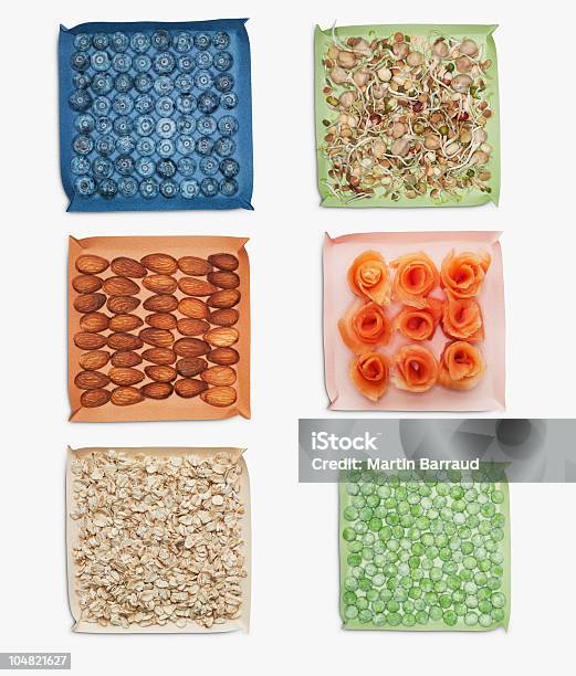 Berries Nuts Vegetables And Herbs In Dishes Stock Photo - Download Image Now - Oats - Food, White Background, Cereal Plant