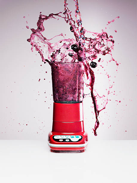 Blueberry juice splashing from blender  blender photos stock pictures, royalty-free photos & images