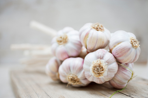 a collection of garlic that is ready to be used as a cooking ingredient