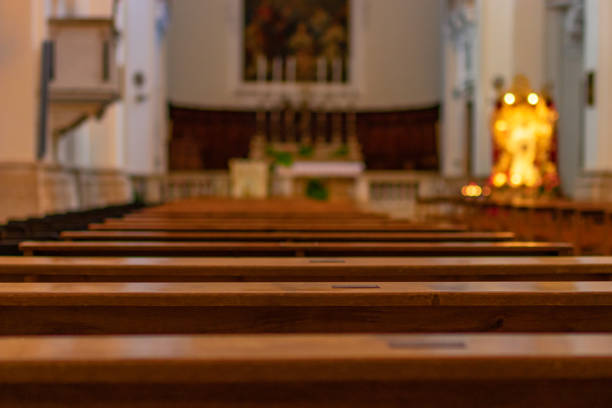 church benches in the empty catholic church. italy - pew imagens e fotografias de stock