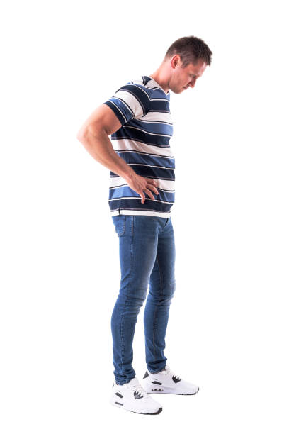 istock Side view of young disappointed sad man looking down with hands on hips 1048226872