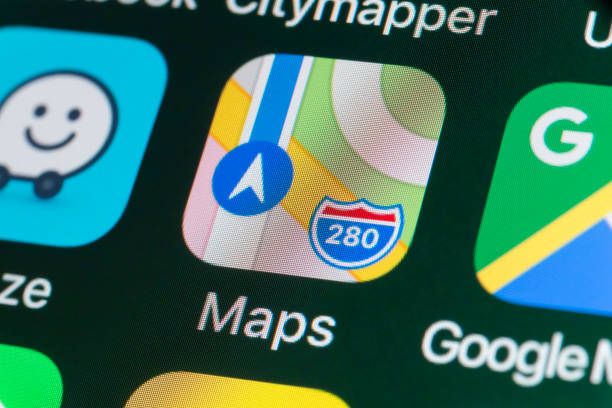 Apple Maps, Google Maps, Waze and other Apps on iPhone screen stock photo