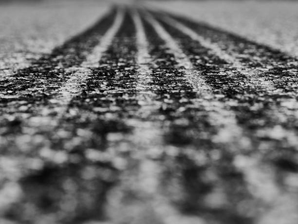 black track of tires of cars on asphalt black track of tires of cars on asphalt street skid marks stock pictures, royalty-free photos & images