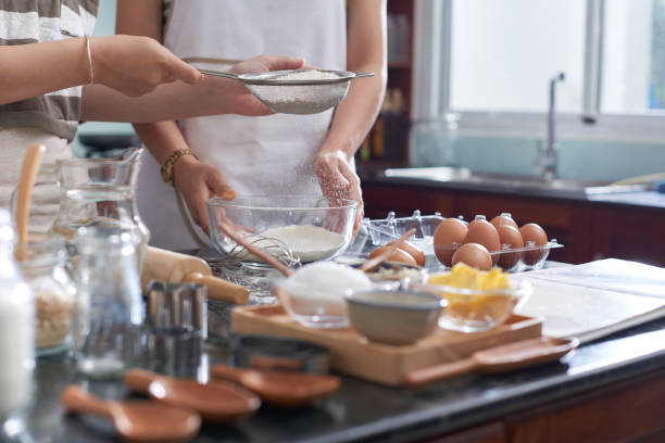 istock Women Preparing Cookies 1048238230