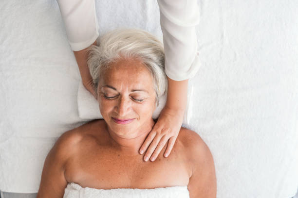istock Senior woman having neck massage 1048243082