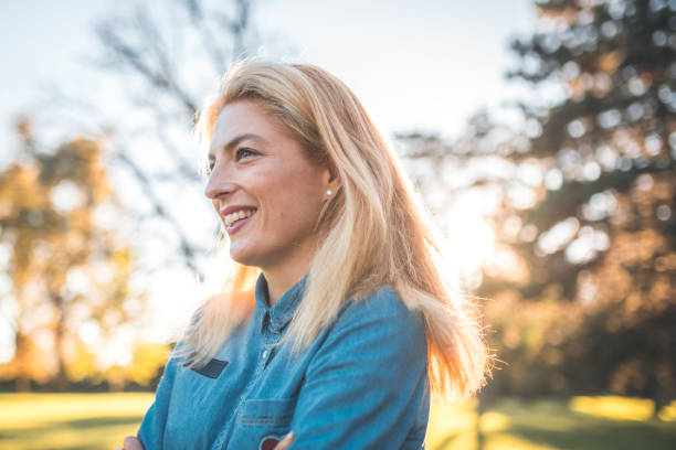 istock Woman enjoying outdoors at sunset 1048247672