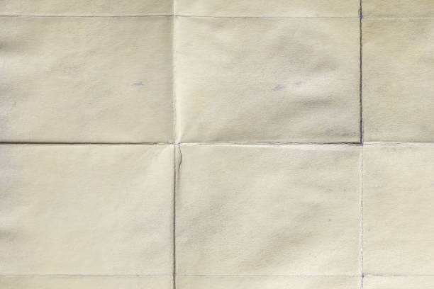 istock Blank surface, old paper sheet with creases 1048248224