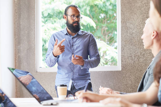istock Businessman standing at meeting 1048253008