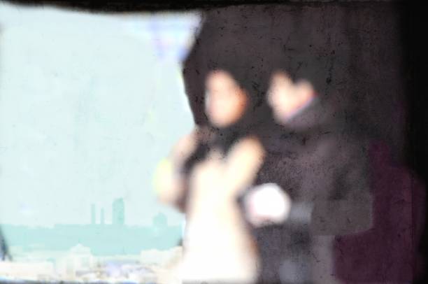 istock Blurred young couple walking at a shopping mall. 1048257600