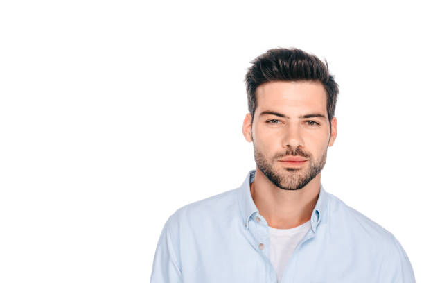istock portrait of handsome young man looking at camera isolated on white 1048257682
