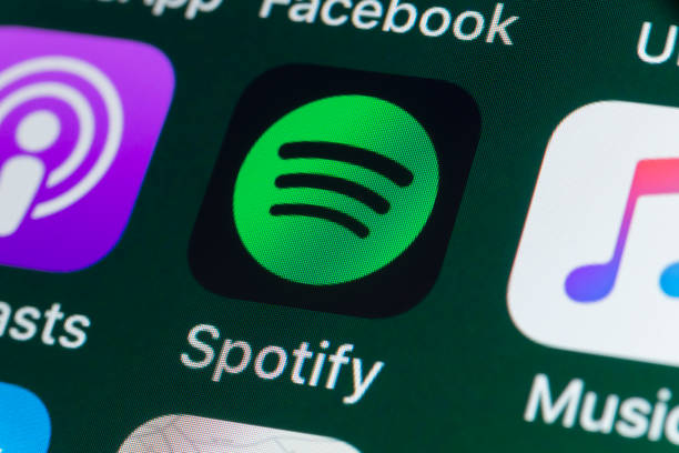 Spotify, Podcasts, Music and other Apps on iPhone screen stock photo