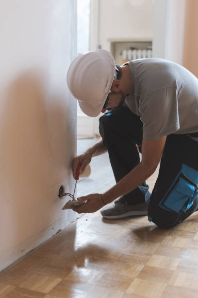 istock Professional electrician, installing sockets at home 1048258636