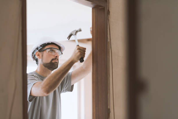 istock Carpenter installing a door jamb at home 1048259704