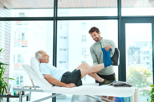 istock Doing what he can to get his patient on his feet again 1048259804