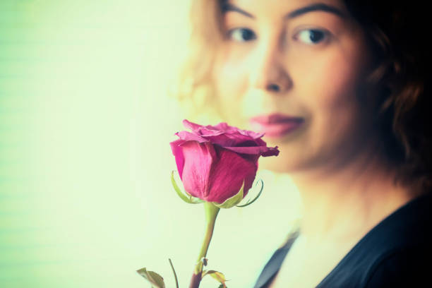 Beautiful girl with red rose