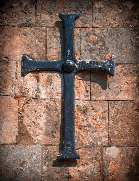 istock Metal cross on a church wall 1048269390