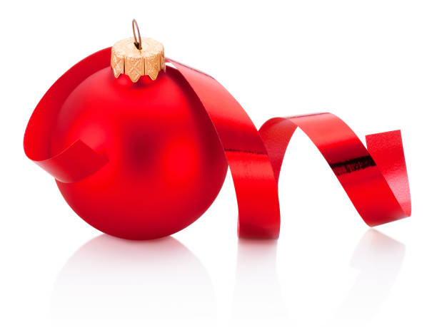 istock Christmas red bauble and curling paper Isolated on white background 1048270434