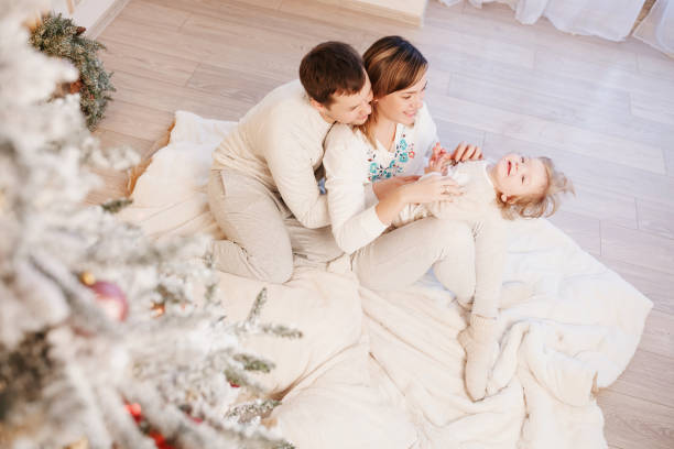 istock Young family on Christmas 1048270436