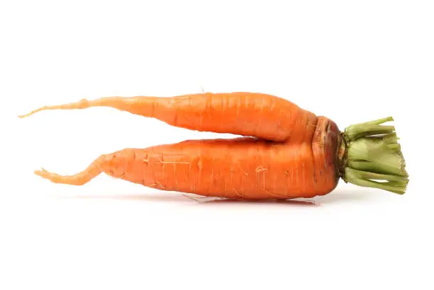 Deformed carrot isolated on white background