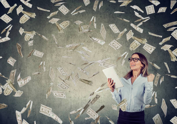 istock Successful young woman using tablet computer building online business 1048280172