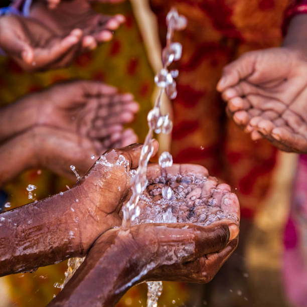 istock Hands of poor - African children asking for drinking water 1048288518