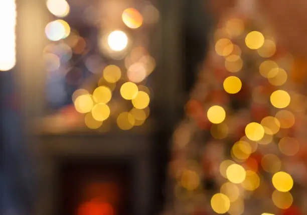 Christmas home room with tree and festive bokeh lighting, blurred holiday background Christmas home room with tree and festive bokeh lighting, blurred holiday background