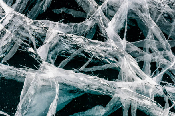 istock Blue cracked surface of the ice surface 1048289488