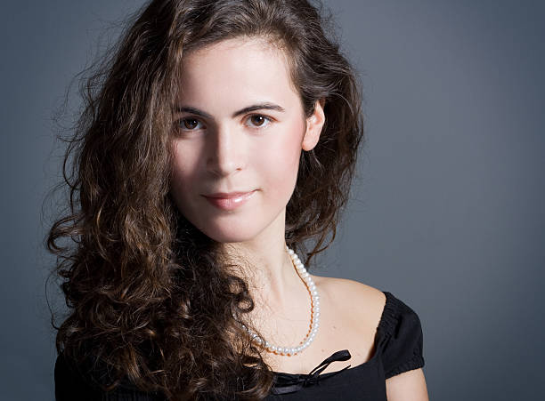 istock brunette with a curly hair 104829082