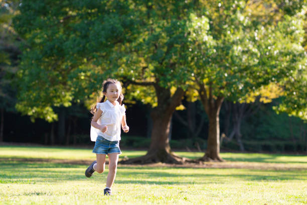 istock Girl run in the park 1048290854