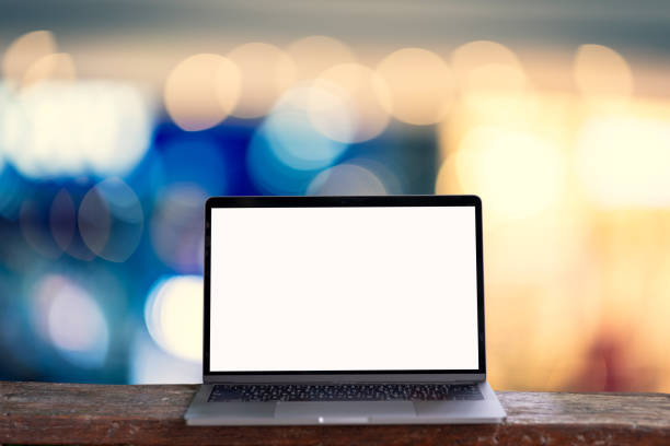 istock Laptop computer on wooden floor,Abstract blurry background. 1048293686