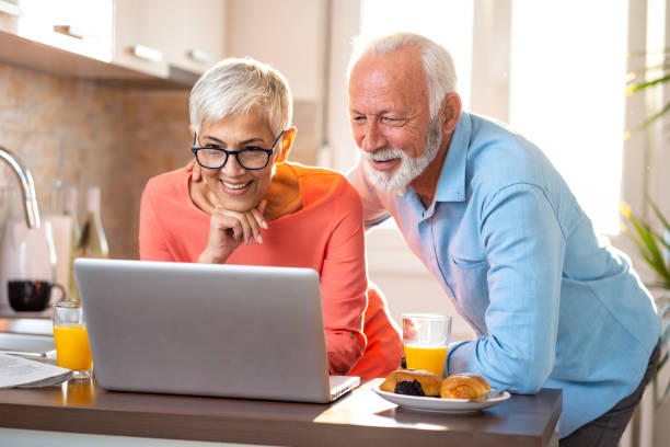 istock Senior couple using technology to keep in touch with family 1048294494