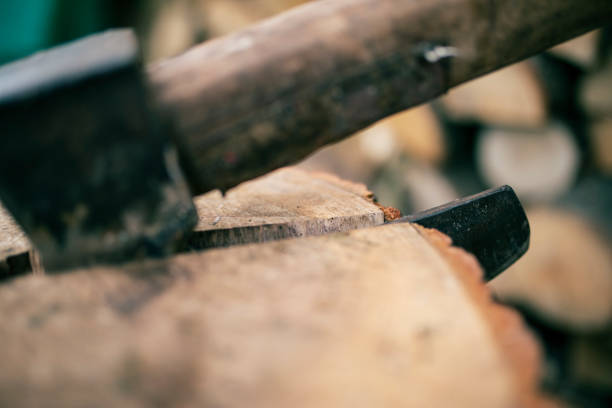istock A axe stuck in a piece of wood 1048295862