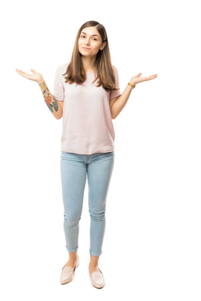 istock Young Woman Shrugging And Spreading Hands On White Background 1048300336