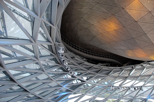 Futuristic and abstract indoor design of a car showroom building. Munich, Germany. BMW World.