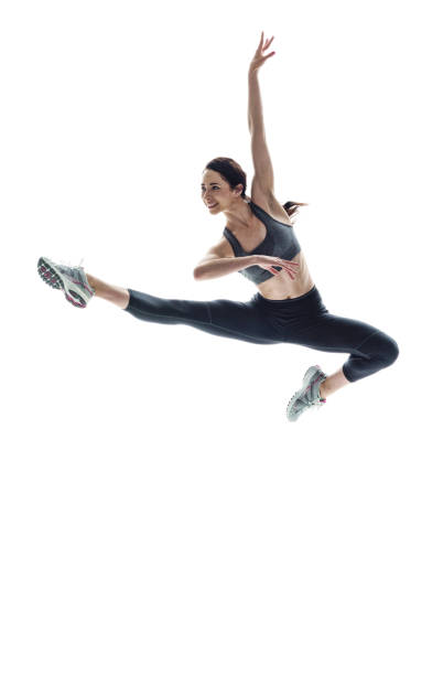 istock Beautiful athletic woman dancing in midair 1048301494