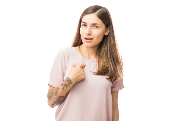 istock Woman Pointing At Herself And Showing Doubtful Facial Expression 1048305380